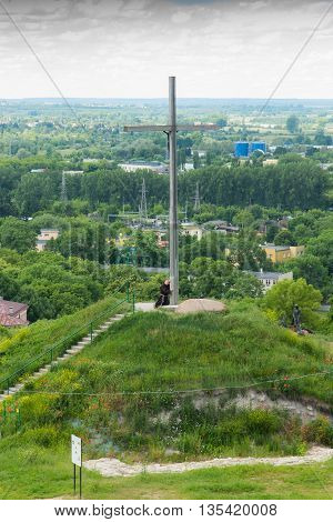 Chelm Poland - June 12 2016: The cross on the way of the cross in a park next to the shrine of the Virgin Mary in Chelm in eastern Poland