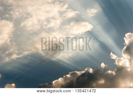 Sun breaking casting beams trough the beautiful cloudscape