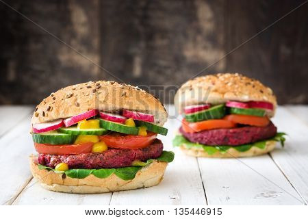 Veggie beet burgers on white wooden table