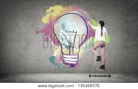 Young woman in casual drawing creativite idea concept on wall
