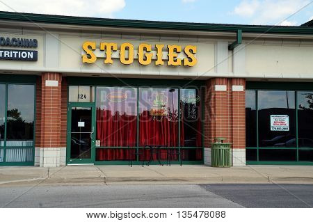 NAPERVILLE, ILLINOIS / UNITED STATES - JULY 23, 2015: One may purchase cigars and other tobacco products at Stogies, in a Naperville strip mall.