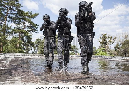Spec ops police officers SWAT in action in the water