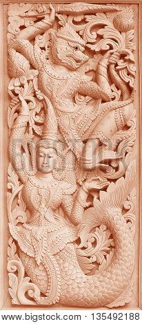 Traditional Old wood carving on the wall of Temple in Thailand Thai style