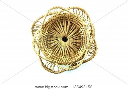 Brown wicker basket top view isolated on white background