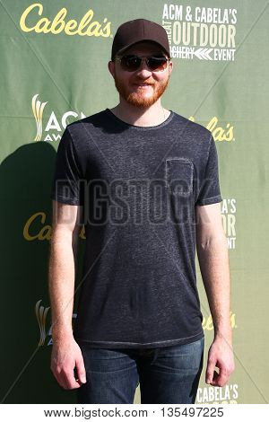 ARLINGTON, TX - APR 18: Recording artist Eric Paslay attends the ACM & Cabela'??s Great Outdoor Archery Event at the Texas Rangers Youth Ballpark on April 18, 2015.
