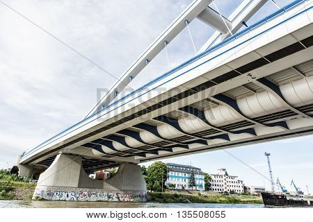 Modern Apollo bridge in Bratislava Slovak republic. Architectural theme. Ship transportation. Infrastructure theme. Danube river.