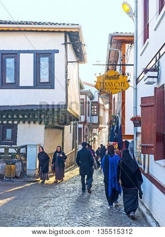 ANKARA TURKEY - JANUARY 16 2015: The narrow streets of the Turkish village in old Ankara are full of tourists climbing on the Castle Hill to discover the medieval landmark on January 16 in Ankara.