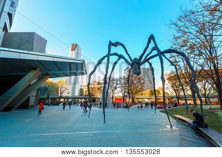 TOKYO JAPAN - NOVEMBER 28 2015: Maman - a spider sculpture by Louise Bourgeois situated at the base of Mori tower building in Roppongi Hills