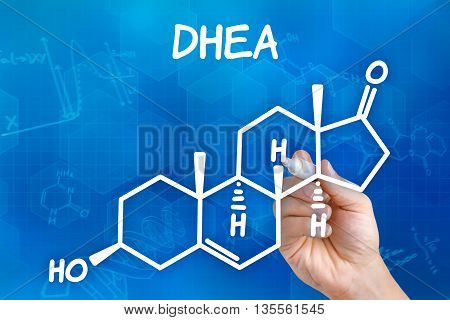 Hand With Pen Drawing The Chemical Formula Of Dhea