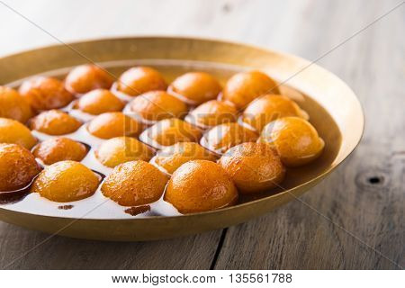 Gulab jamun, or gulaab jamun, is a milk-solids-based sweet mithai