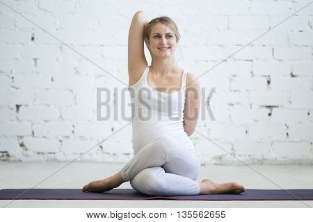 Pregnant Young Woman Doing Prenatal Yoga Gomukhasana Pose