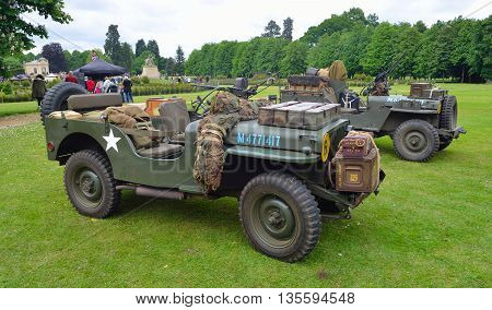 Silsoe, Bedfordshire, England - May 30, 2016: World War 2 Jeeps with  mounted Machine guns parked on grass.