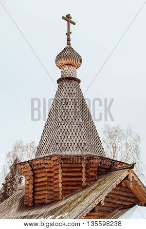 Woden dome of Russian Orthodox church. Wooden church. Church with wooden cross and dome.