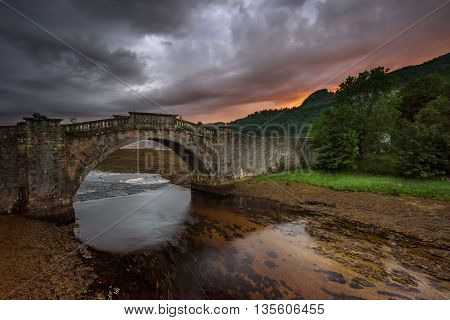 Garron Bridge on Gearr-Abhainn river in sunset light Highlands Scotland