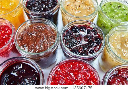 Mix of jams. Jars with colorful jams