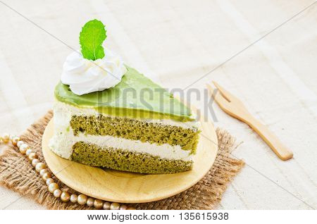 Japanese Matcha Green tea cake on tablecloth.