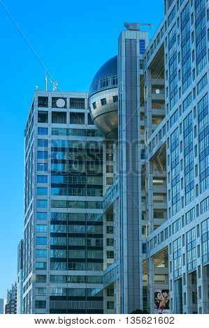 TOKYO JAPAN - NOVEMBER 27 2015: Fuji T.V. headquarters one of the most striking buildings in Japan. its' futuristic metallic clad building featuring a massive silver ball 32 metres in diameter