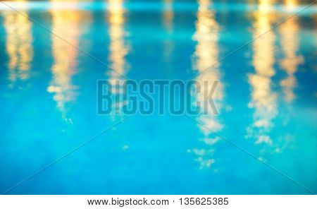 blue water in swiming pool with light in summer