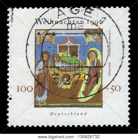 GERMANY - CIRCA 1996: a stamp printed in the Germany shows christmas, miniature of the Reichenau school of painting, circa 1996