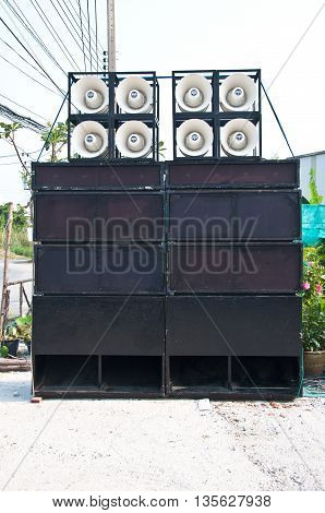 many black big loudspeaker in public park