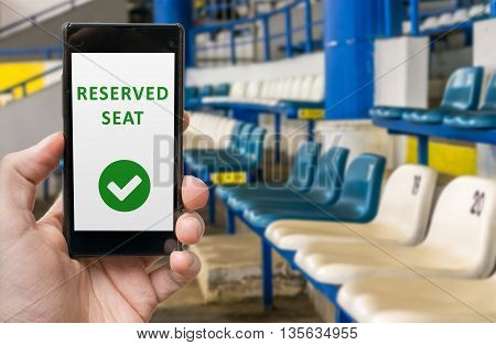 Man Has Reserved Seat In Stadium Online Via Smartphone.