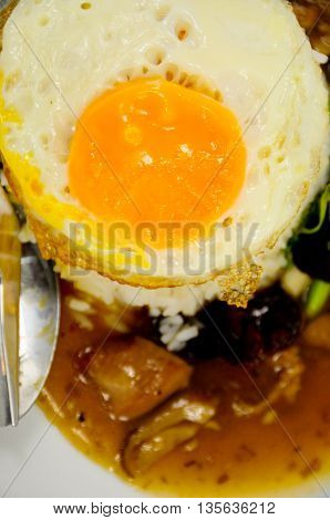 Fried rice with egg and pig on a plate