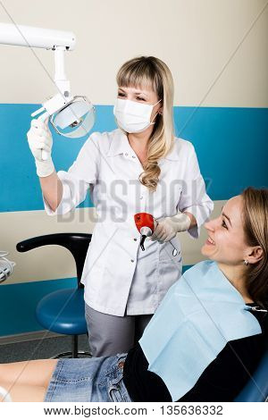 The reception was at the female dentist. Doctor examines the oral cavity on tooth decay. Caries protection. doctor puts the patient an anesthetic injection. close-up of the patient's mouth and squirt.