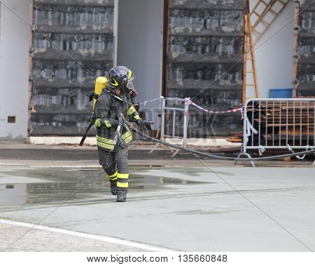 Firefighters With Breathing Apparatus And Oxygen Cylinder Runs