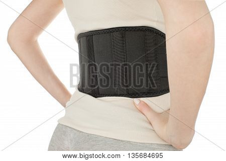 Female torso while wearing the therapeutic belt view from the back on a white background, isolate, horizontal