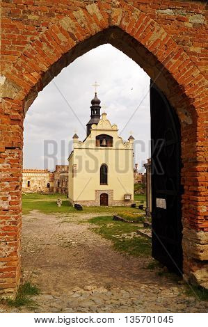 View of the church of St. Michael through the arch gate in Medzhybozh fortress