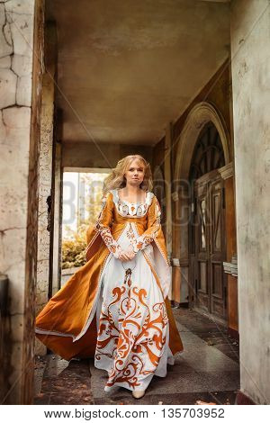 Beautiful lady with blond hairs in medieval dress
