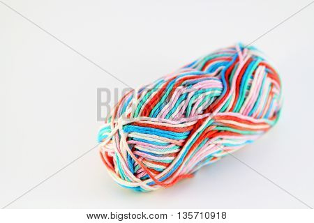 bale of wool of different colors with white background