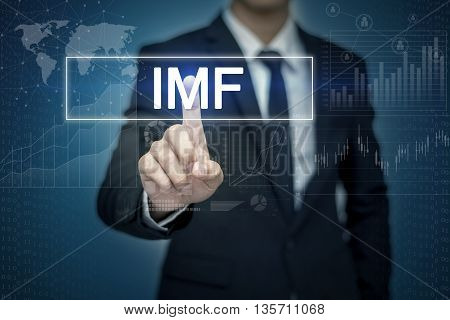 Businessman hand touching IMF button on virtual screen