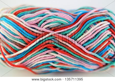 bale of wool of different colors with white background