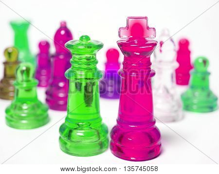 Colorful chess made of glass isolated on white background