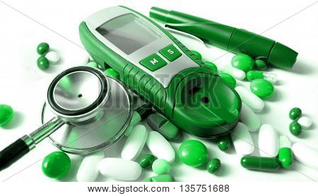 Stethoscope and device for measuring blood sugar level and isolated on white background      