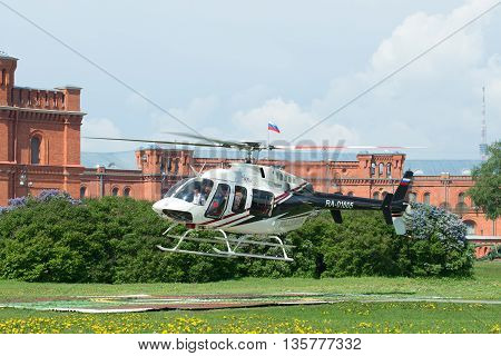 SAINT PETERSBURG, RUSSIA - MAY 22, 2016: The take-off of a private helicopter Bell 407GX (RA-01605) from the helicopter pad at the Peter and Paul fortress