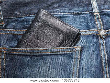 Jeans texture Blue denim jeans with black lether wallet (focus on wallet)