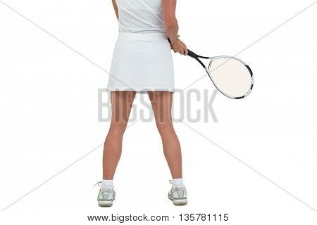 Athlete playing tennis with a racket on white background
