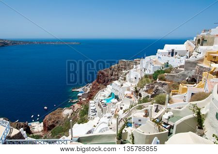 Oia village and Port of Ammoudi below on the island of Thira (Santorini) Greece.