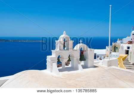 Oia Orthodox church on the edge of the Santorini caldera cliffs on the island of Thira (Santorini) Greece.