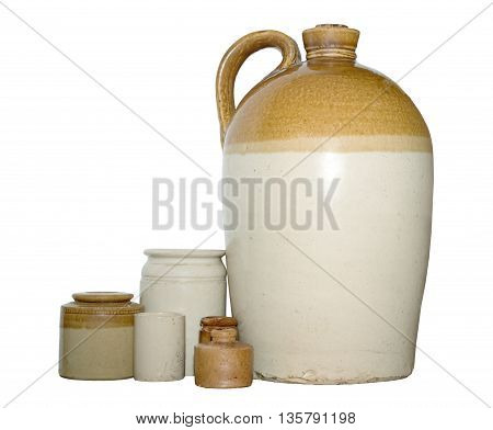 Earthenware flagon with mixed pots worn from age on an isolated white background with a clipping path