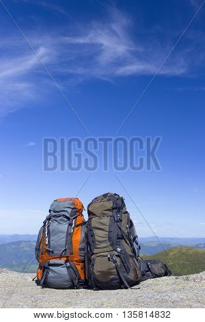 Camping with backpacks in the mountains with views of the mounta