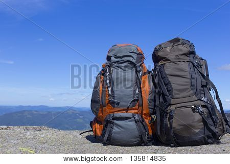 Camping with backpacks in the mountains with views of the mounta