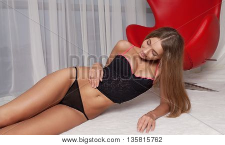Sensual sexy blond woman with perfect slim body posing in lingerie.