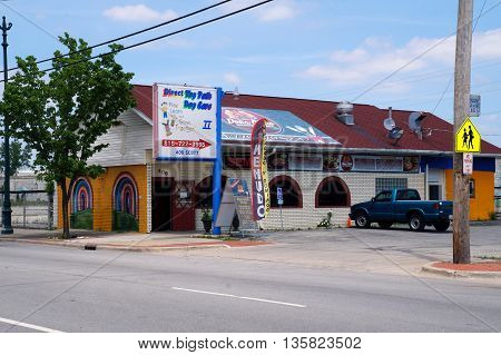 JOLIET, ILLINOIS / UNITED STATES - JUNE 3, 2015: A large sign indicates the Direct Thy Path Day Care II to be directly behind the Doña Chelo Mexican restaurant in downtown Joliet.