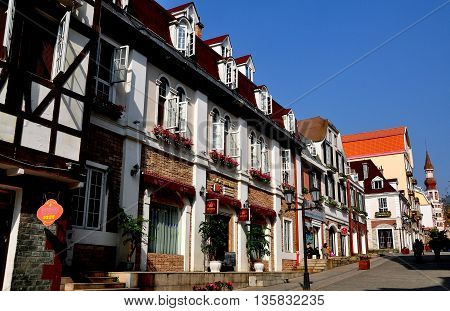 Bai Lu China - November 17 2013: View looking north on the principal street of the Sino-French village with its handsome French Alsatian style buildings