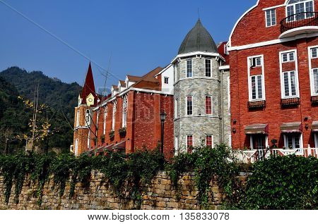 Bai Lu China - November 17 2013: Handsome brick and stone French-style buildings in the Sino-French Village built following the 2008 earthquake