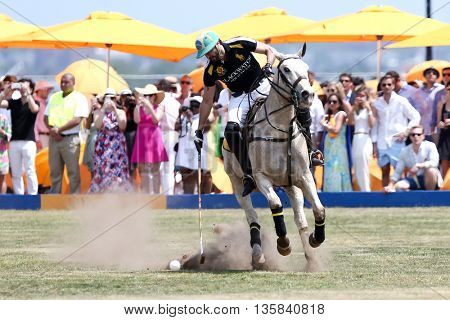 JERSEY CITY, NJ-MAY 30: Rico Mansur handles the ball during a polo match at the 8th Annual Veuve Clicquot Polo Classic at Liberty State Park on May 30, 2015 in Jersey City, NJ.