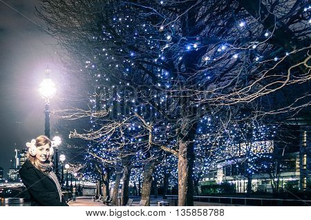 Girl Near A Tree With Christimas Lights